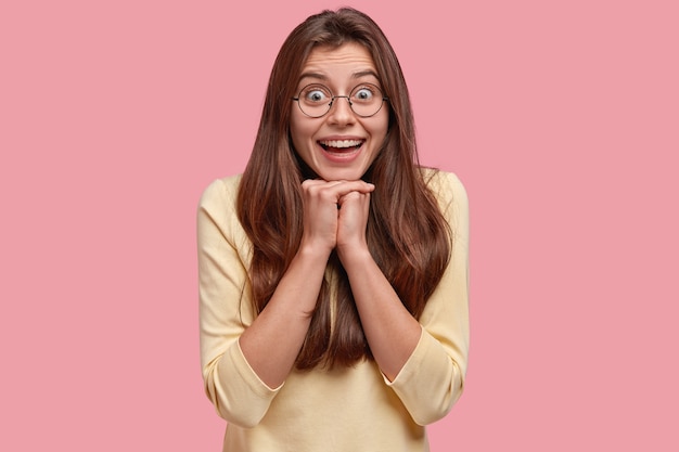 Young brunette woman in yellow blouse