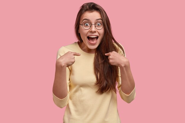 Young brunette woman in yellow blouse