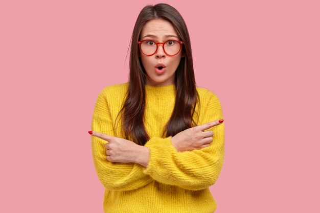 Young brunette woman in yellow sweater