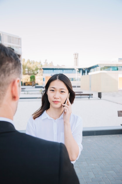 Free photo young business couple make a phone call