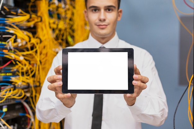 Free photo young business  engineer with a tablet mockup