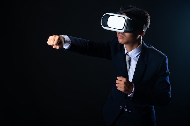 Young business man wearing virtual reality glasses