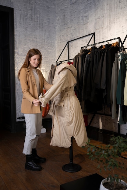 Young business owner preparing her store