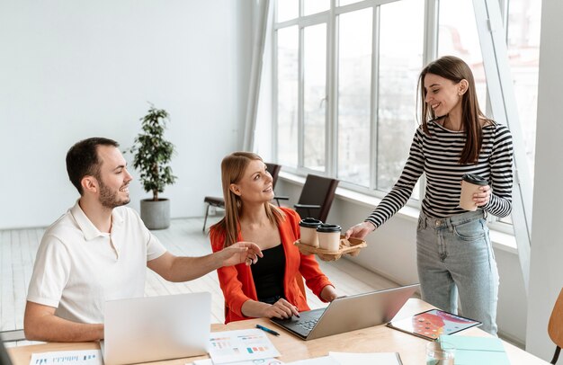 Young business people working on laptop