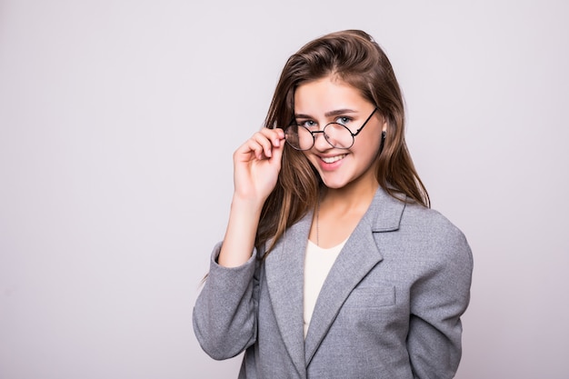 Young business woman in glasses isolated on white background