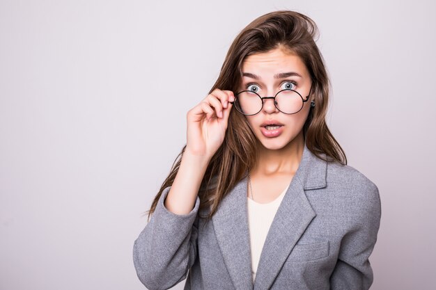 Young business woman in glasses isolated on white background