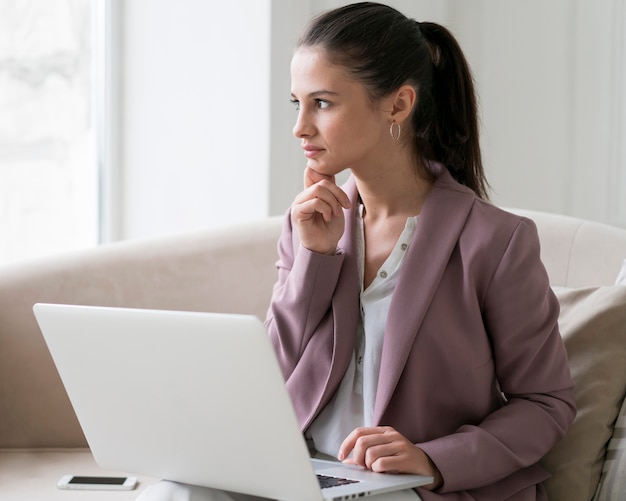 Free photo young business woman having a video call