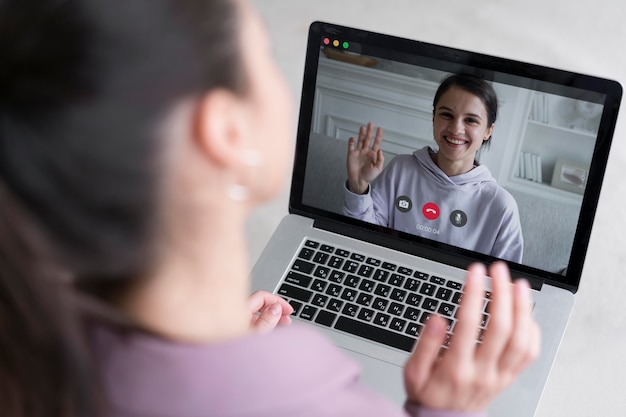 Free photo young business woman having a video call