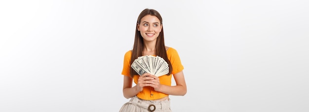 Young business woman holding money isolated on white background