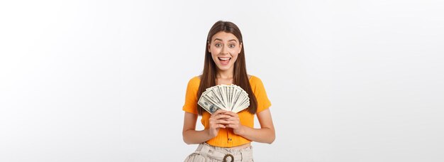 Young business woman holding money isolated on white background