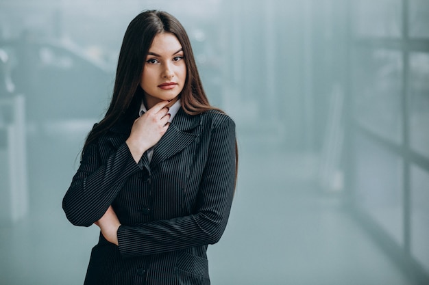 Free photo young business woman inside the office