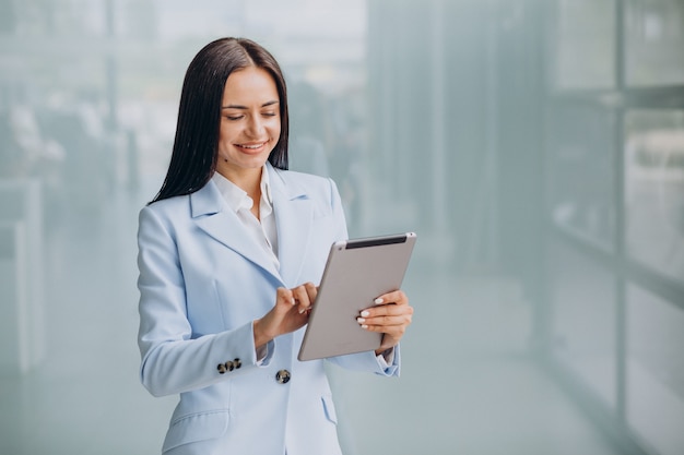 Young business woman isoled holding tablet