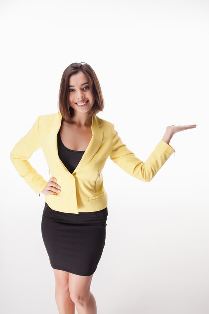 Young business woman showing something posing