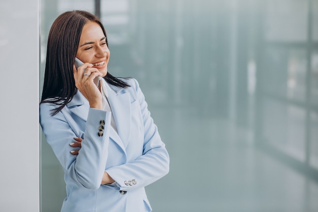 Young business woman using mobile phone