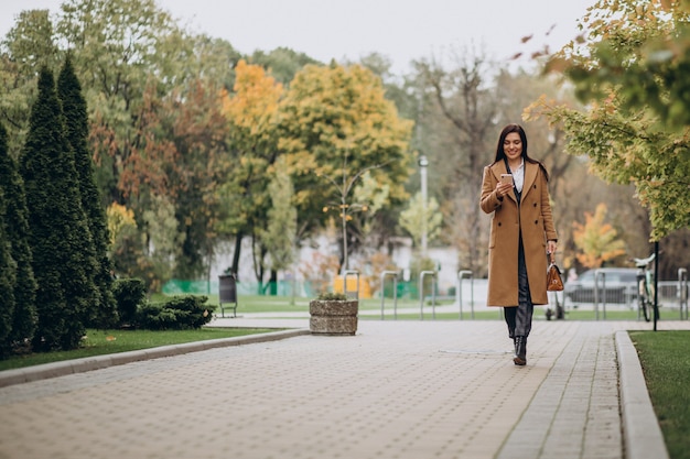 Young business woman using phone