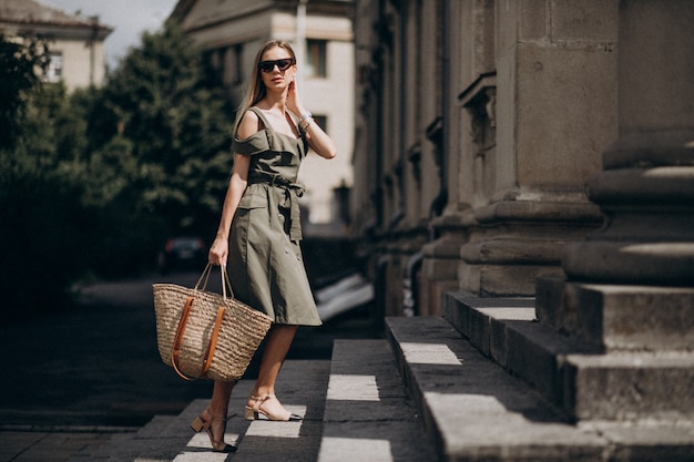 Young business woman walking up the stairs