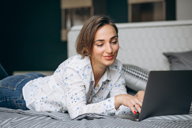 Young business woman working on a computer at home