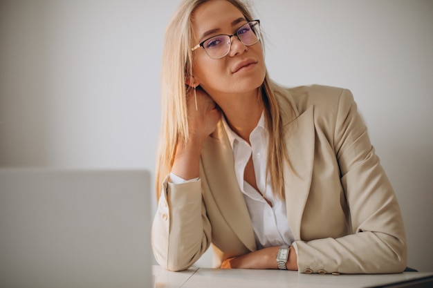 Young business woman working on computer in office