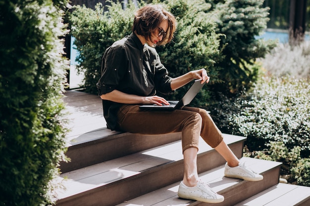 Young business woman working on laptop from home