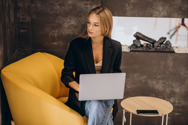 Young business woman working on laptop