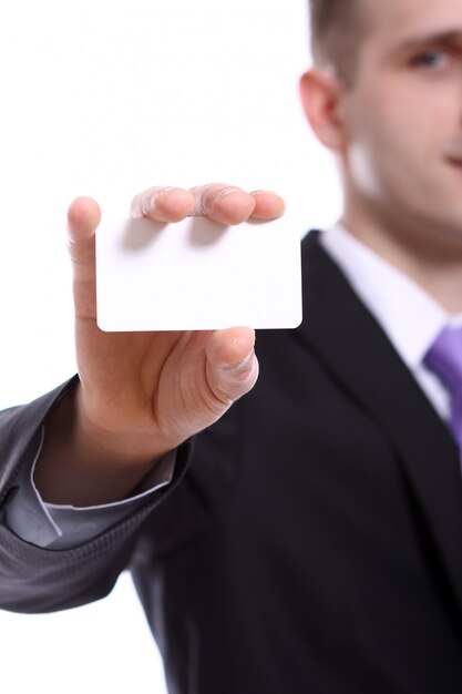 Young businessman holding empty blank