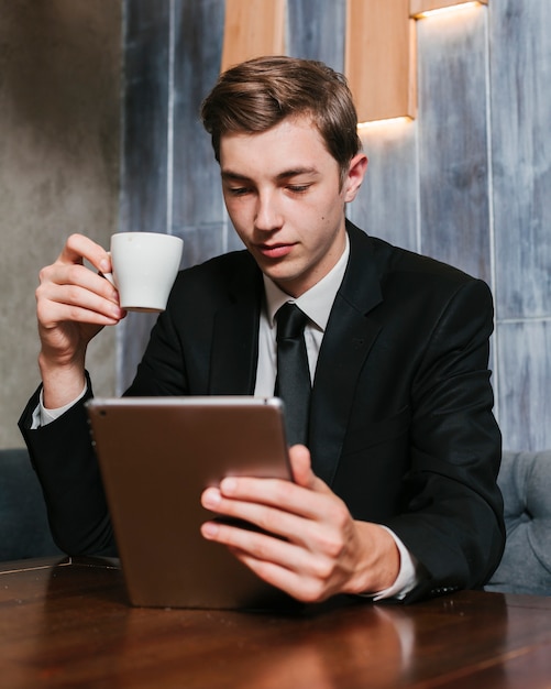 Young businessman looking at the tablet