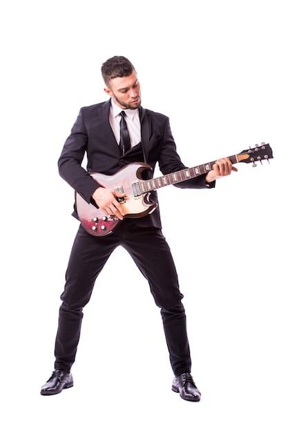 Young businessman playing guitar isolated on white wall