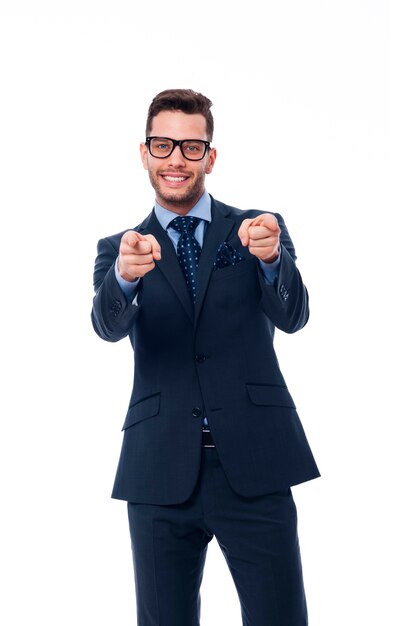 Free photo young businessman pointing to the front