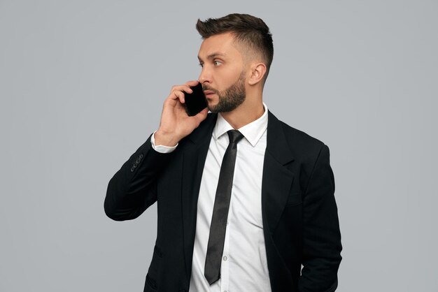 Young businessman talking on phone