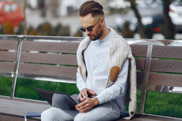 Young businessman walking on the street