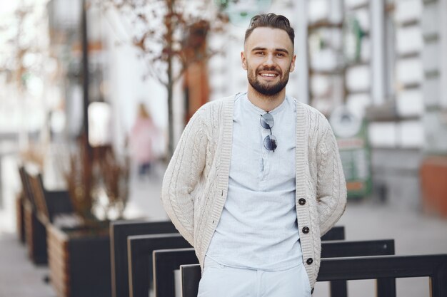 Young businessman walking on the street