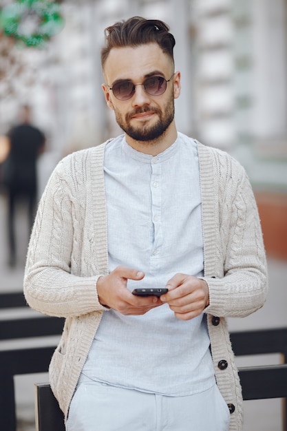 Young businessman walking on the street