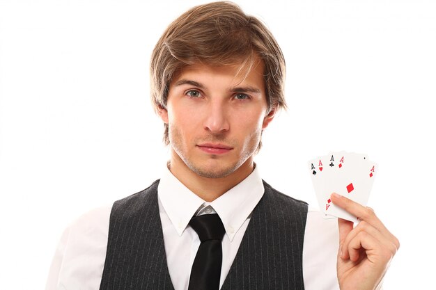 Young businessman with poker cards