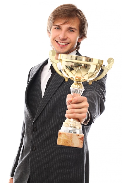 Young businessman with trophy