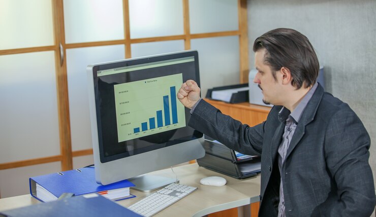 Free Photo young businessman working from his office - the concept of success