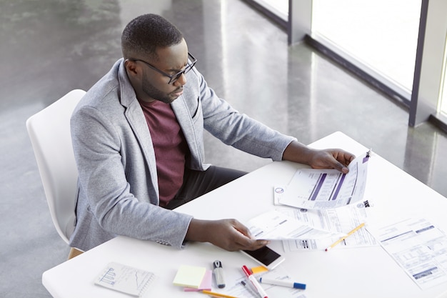 Young businessman working in office