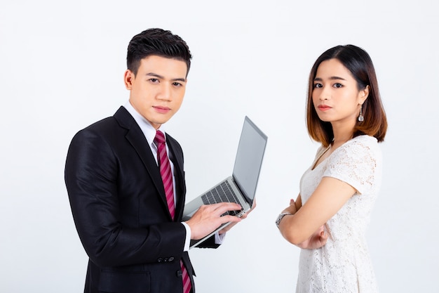 Free photo young businesspeople working with laptop on white