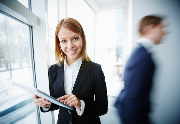 Young businesswoman looking for information on the tablet