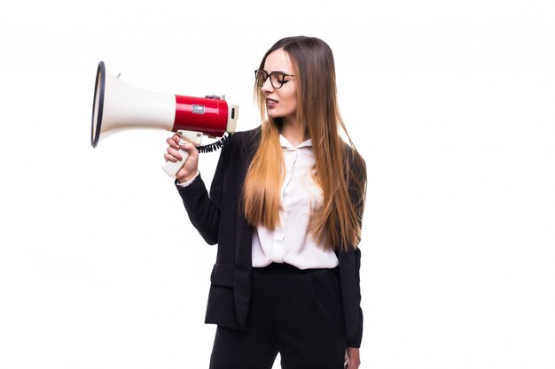 Young businesswoman shouting into loudspeaker on a white
