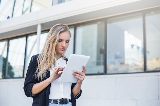 Young businesswoman using digital tablet