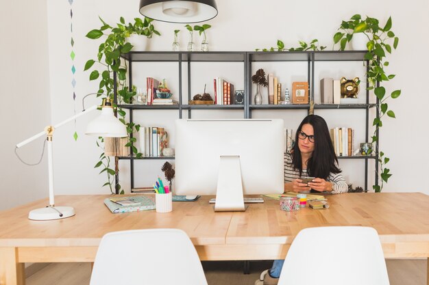 Young businesswoman using her phone