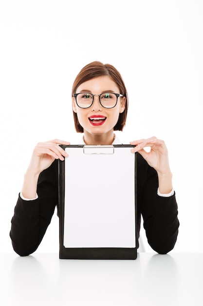 Young businesswoman with blank clipboard