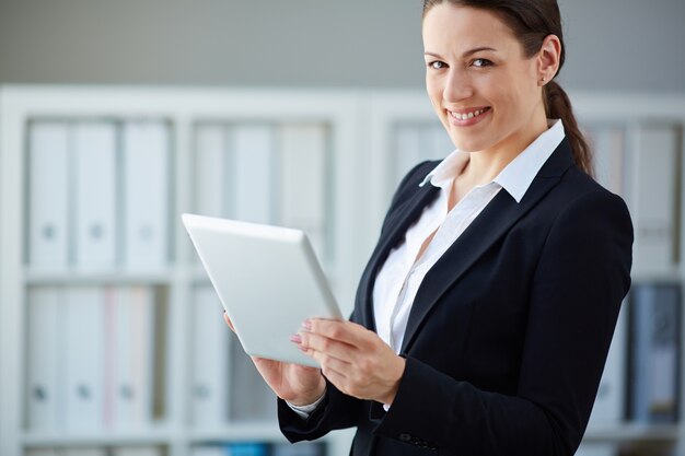 Young businesswoman working with her tablet