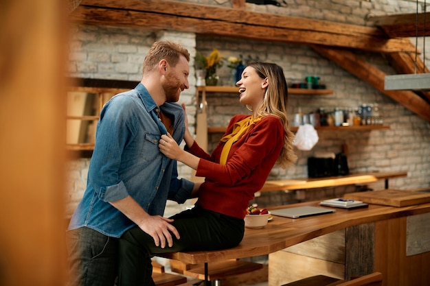 Young carefree couple having fun together at home