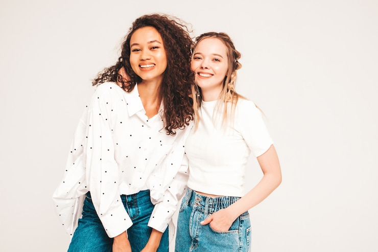 Free Photo young carefree women posing in studio