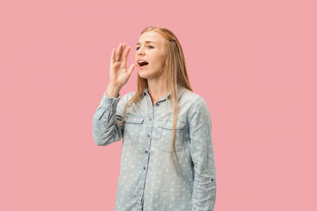 Young casual woman shouting