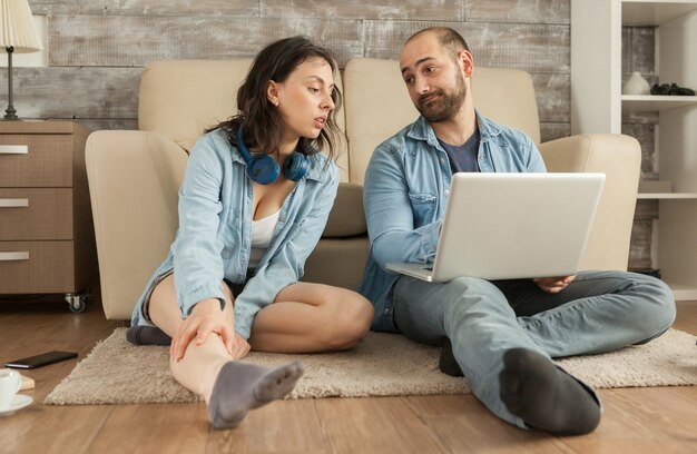 Young caucasian couple doing online shopping