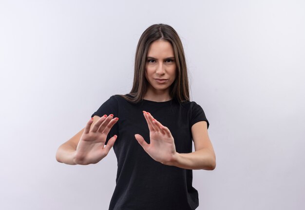 young caucasian girl wearing black t-shirt showing stop gesture on isolated white wall