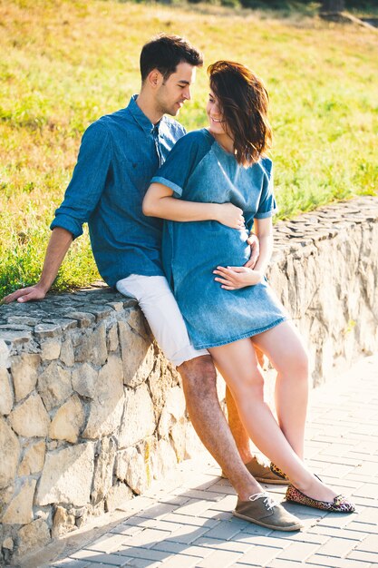 Young Caucasian Man Hugging Pregnant Wife