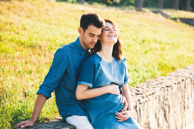 Young Caucasian Man Hugging Pregnant Wife